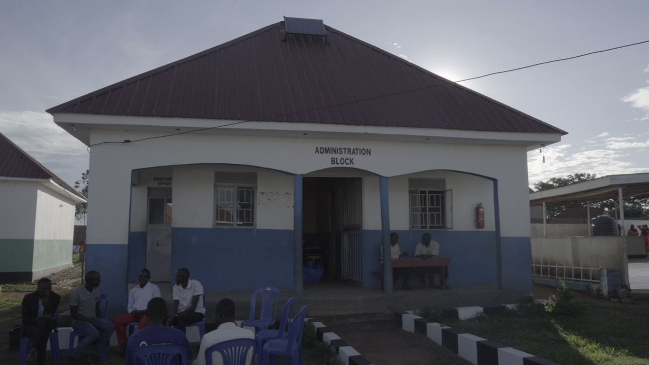 People seated outside the administration block