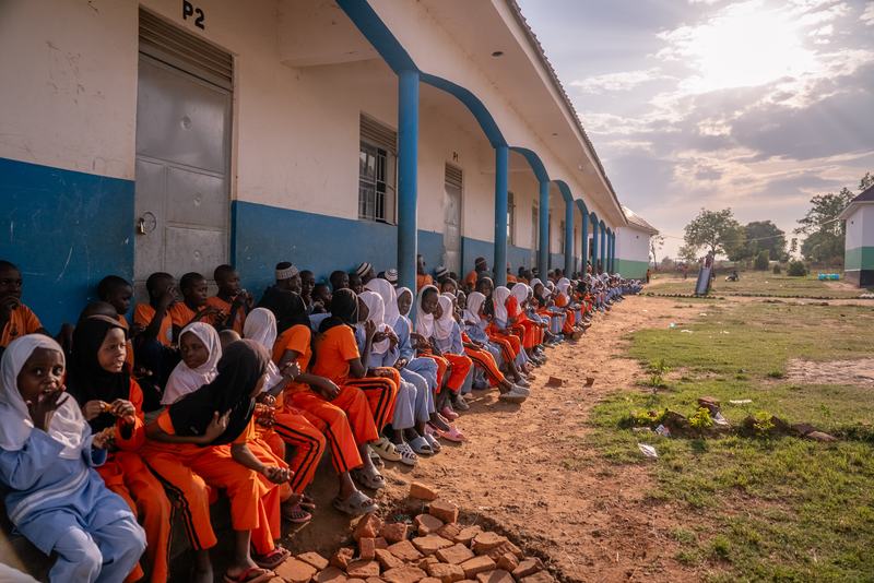 Pupils seated along the dormitory block
