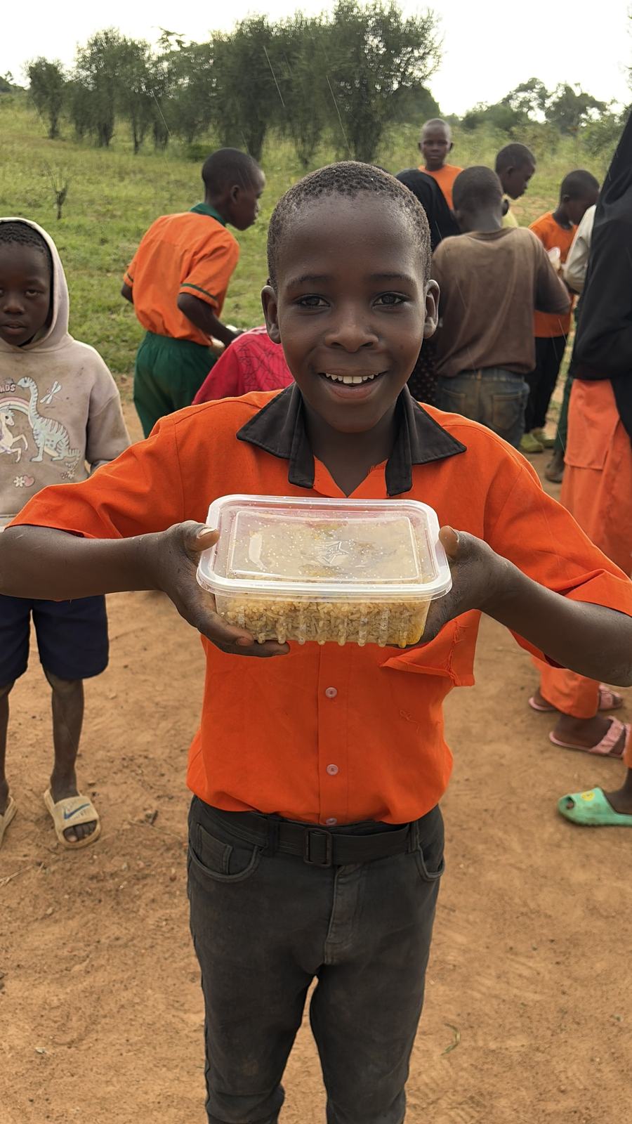 A pupil holding a meal at school