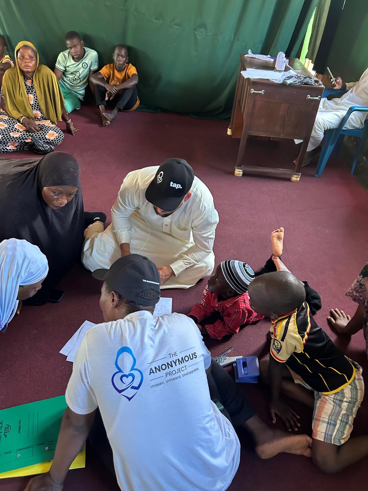Volunteers from The Anonymous Project recording children’s details