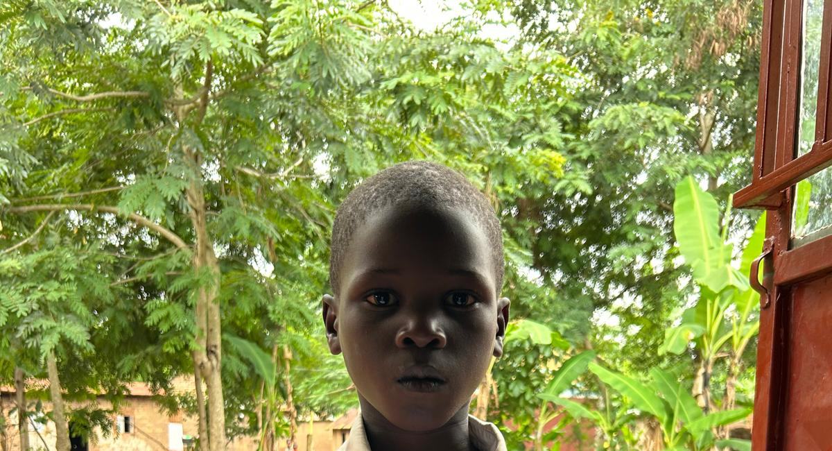 A boy standing outside