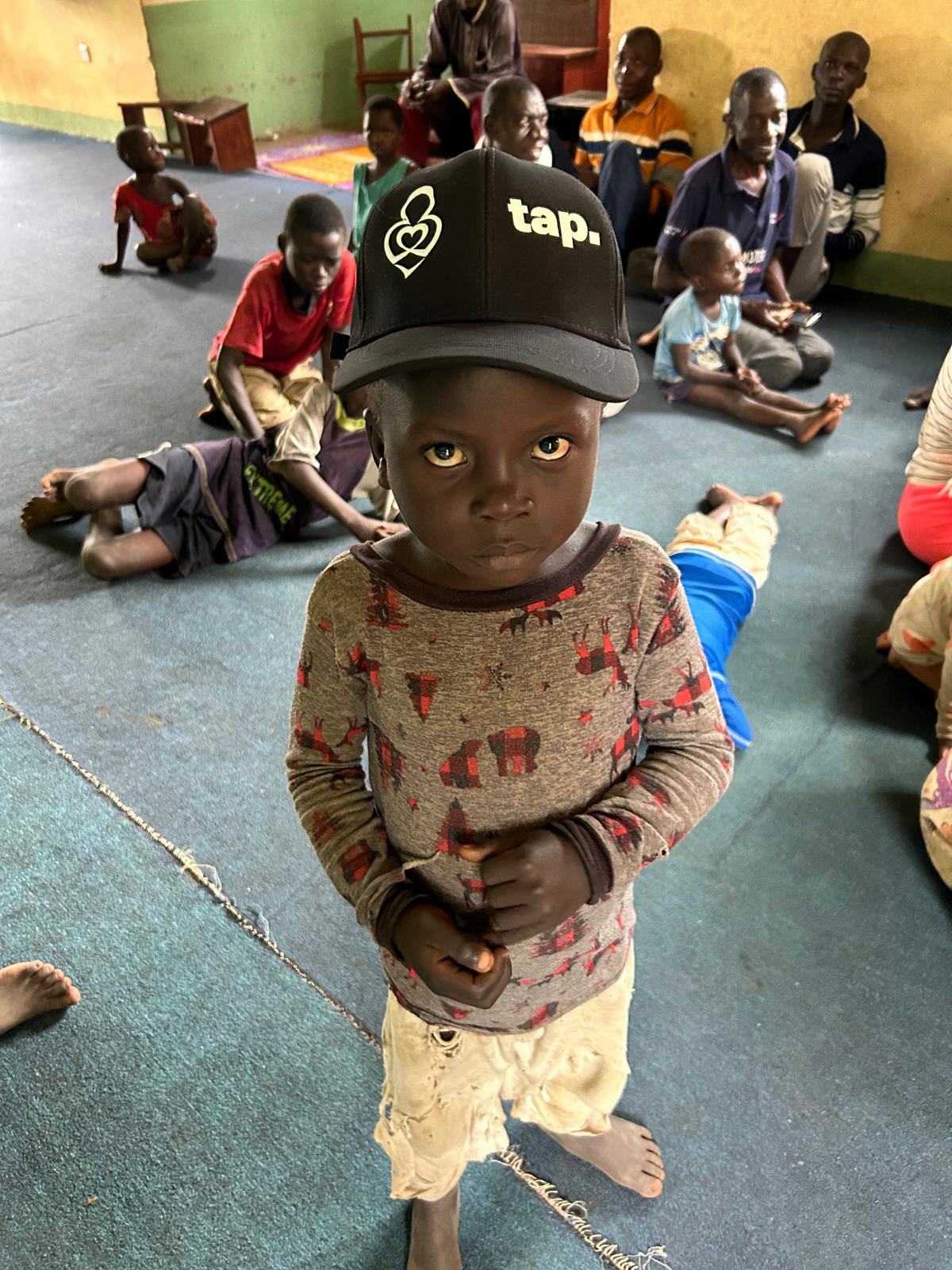A young child standing in the registration room