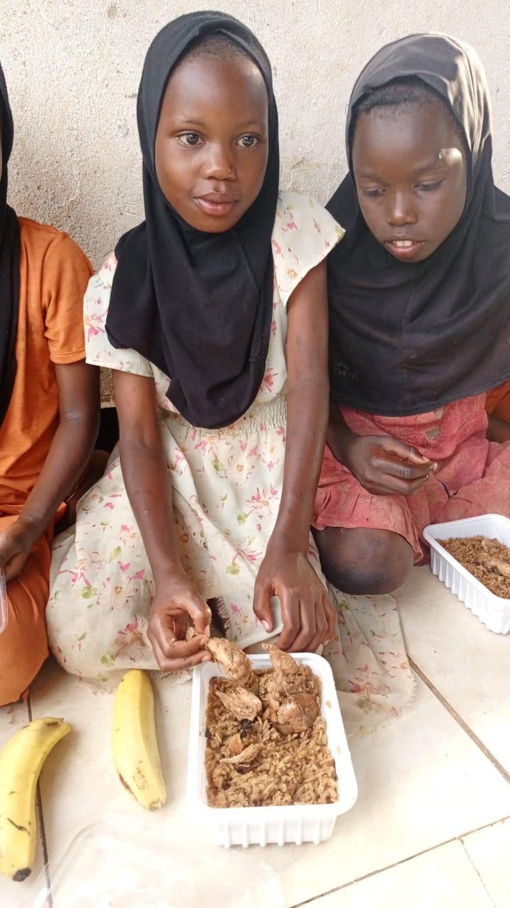 Two girls sharing a meal at school