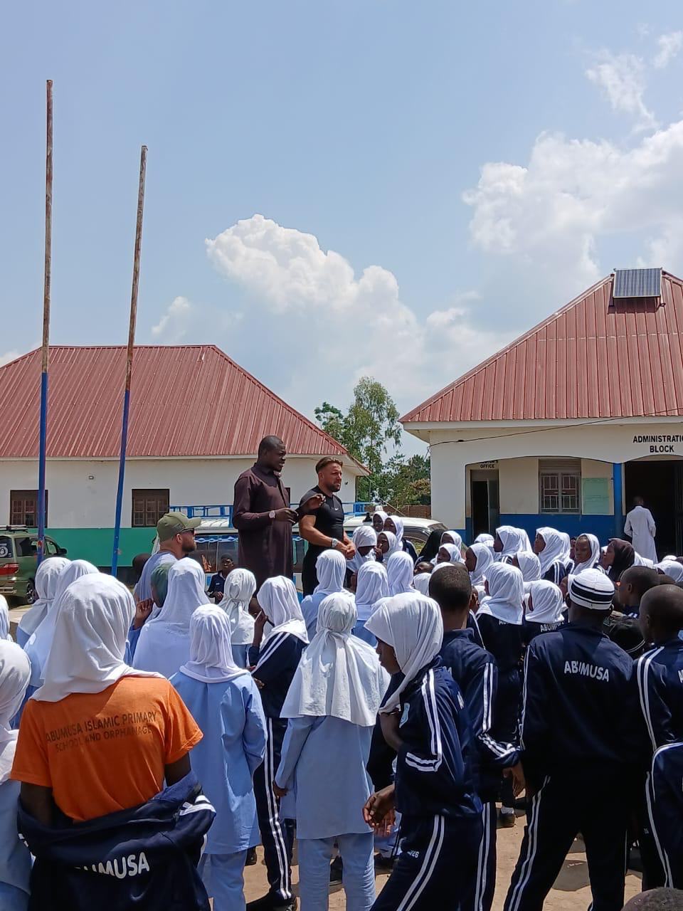 Pupils gathered for assembly in front of the school buildings